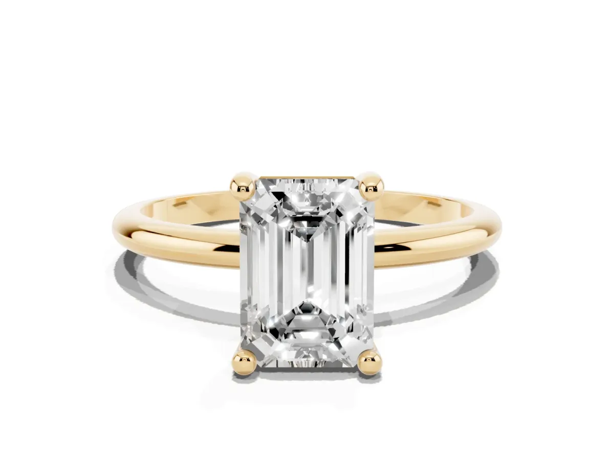 Emerald Cut Solitaire Diamond Ring with 4-Prong Setting on a Classic Band Yellow gold