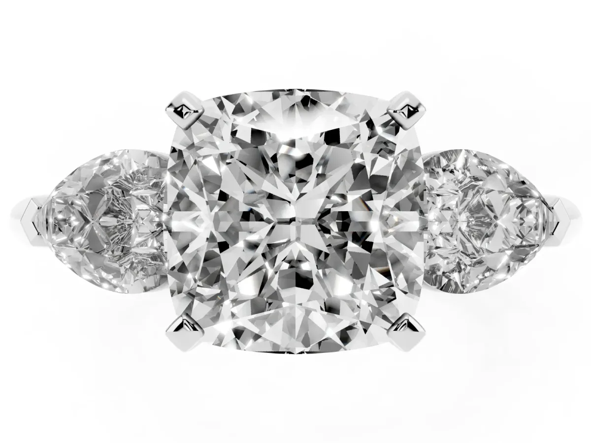 Three-Stone Cushion Cut Diamond Ring with Pear Side Stones and Four-Prong Setting Platinum