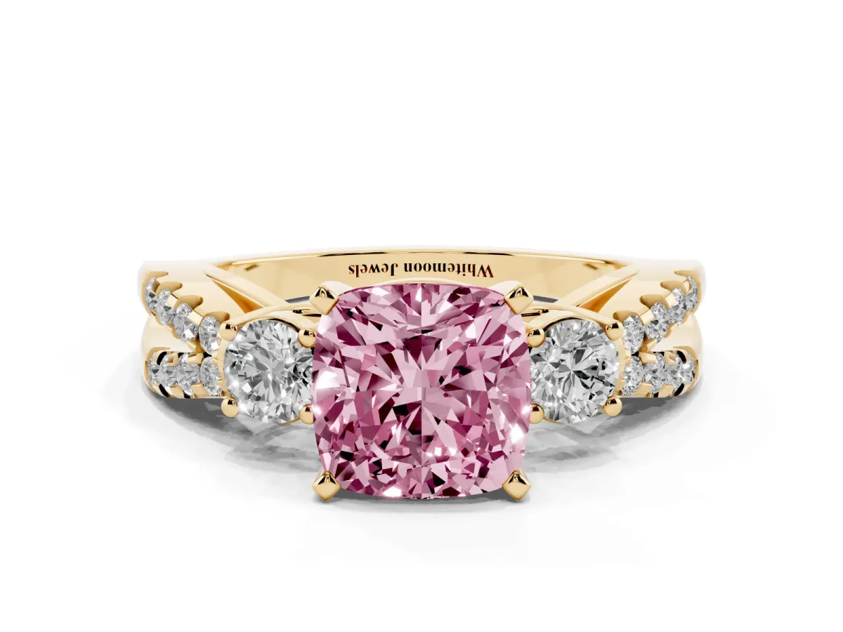 Fancy Pink Cushion Cut Diamond Three-Stone Ring with Pavé Split Shank and Four-Prong Setting Yellow gold