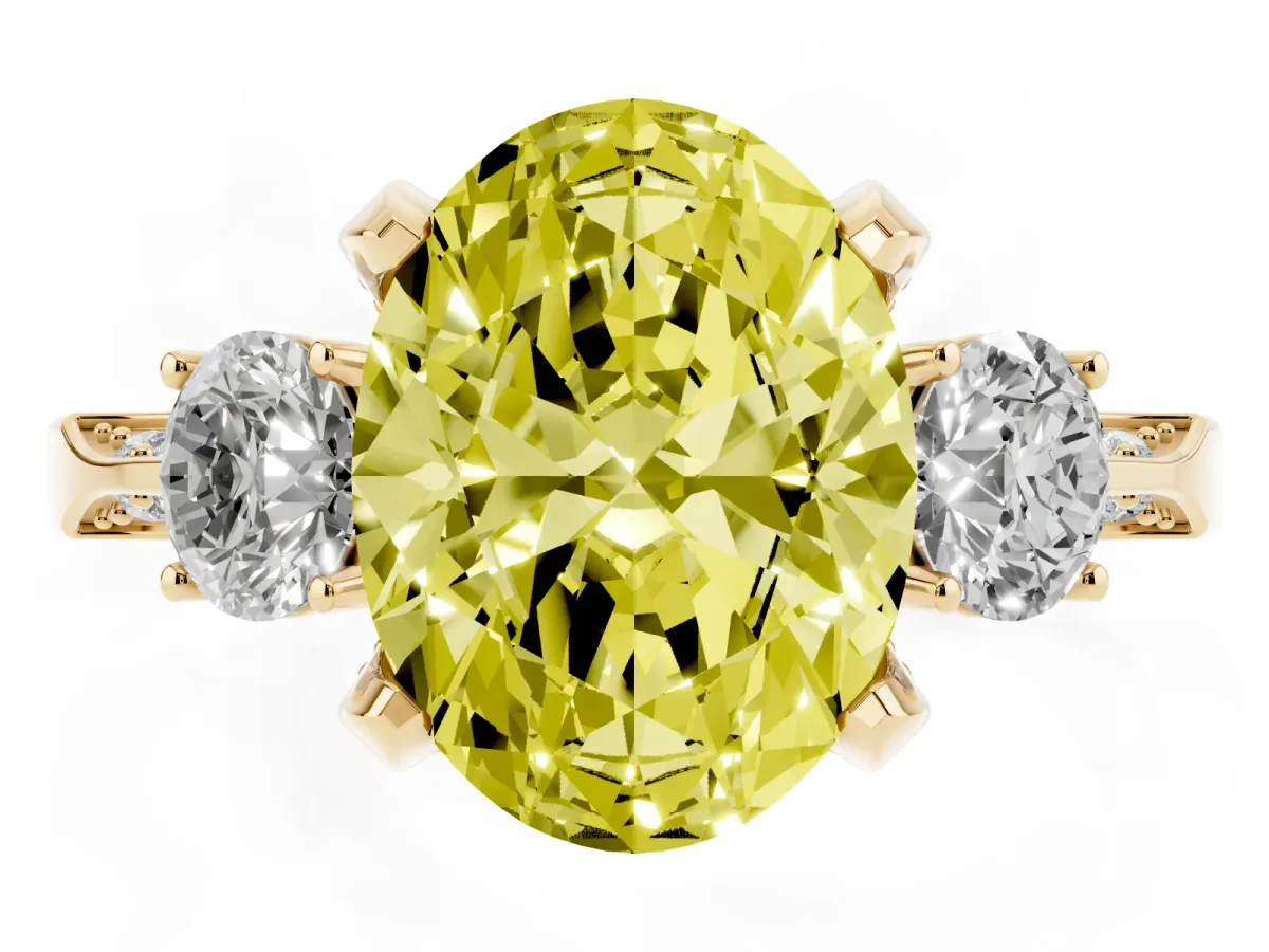 Fancy Yellow Oval Cut Brilliant Three-Stone Diamond Ring with Pavé Band and Four-Prong Setting Yellow gold
