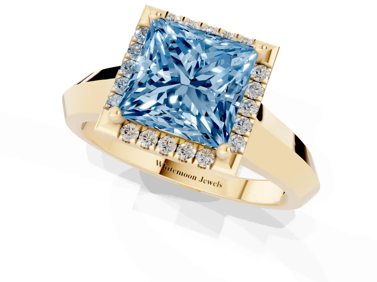 Fancy Blue Princess Cut Halo Diamond Ring with Cathedral Band and Four-Prong Setting Yellow gold