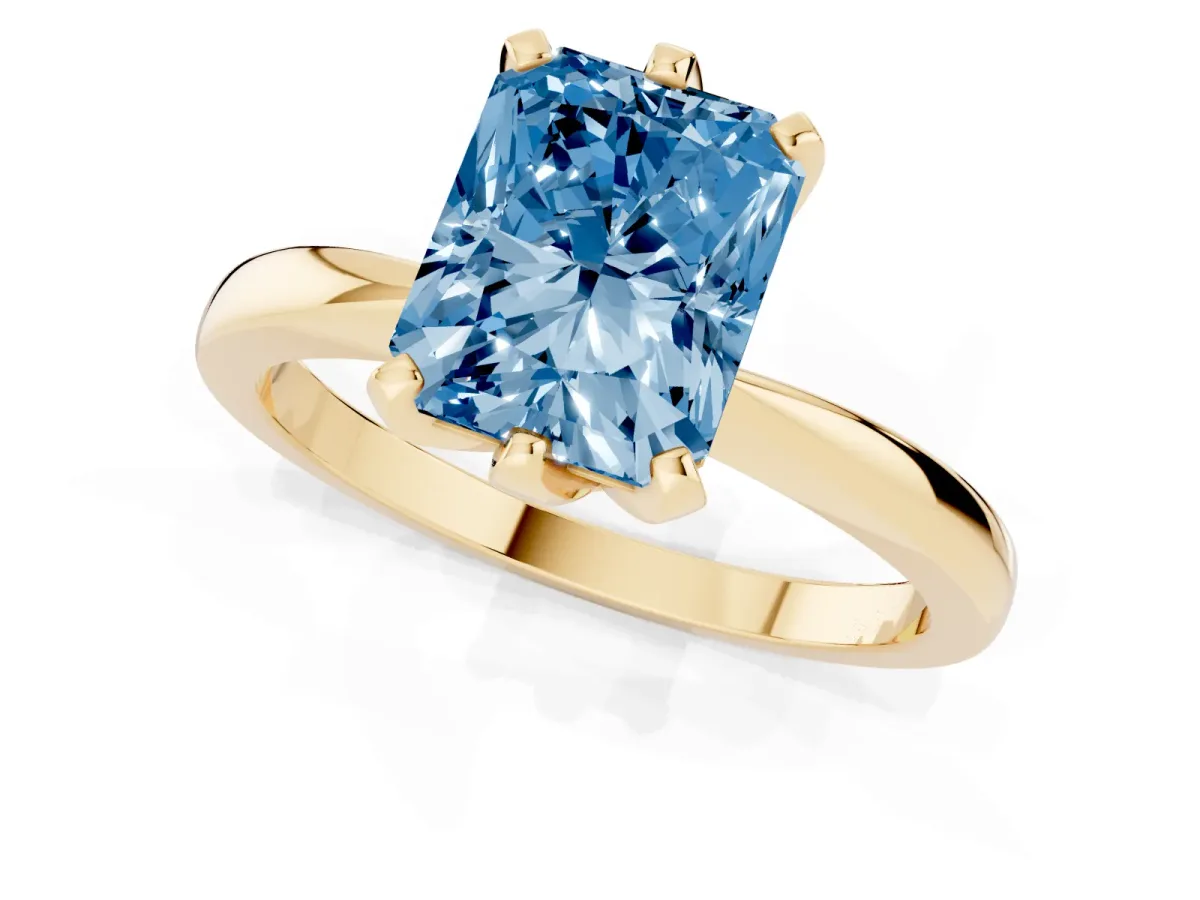 Fancy Blue Radiant Cut Solitaire Engagement Ring with Six-Prong Setting and Tapered Band Yellow gold