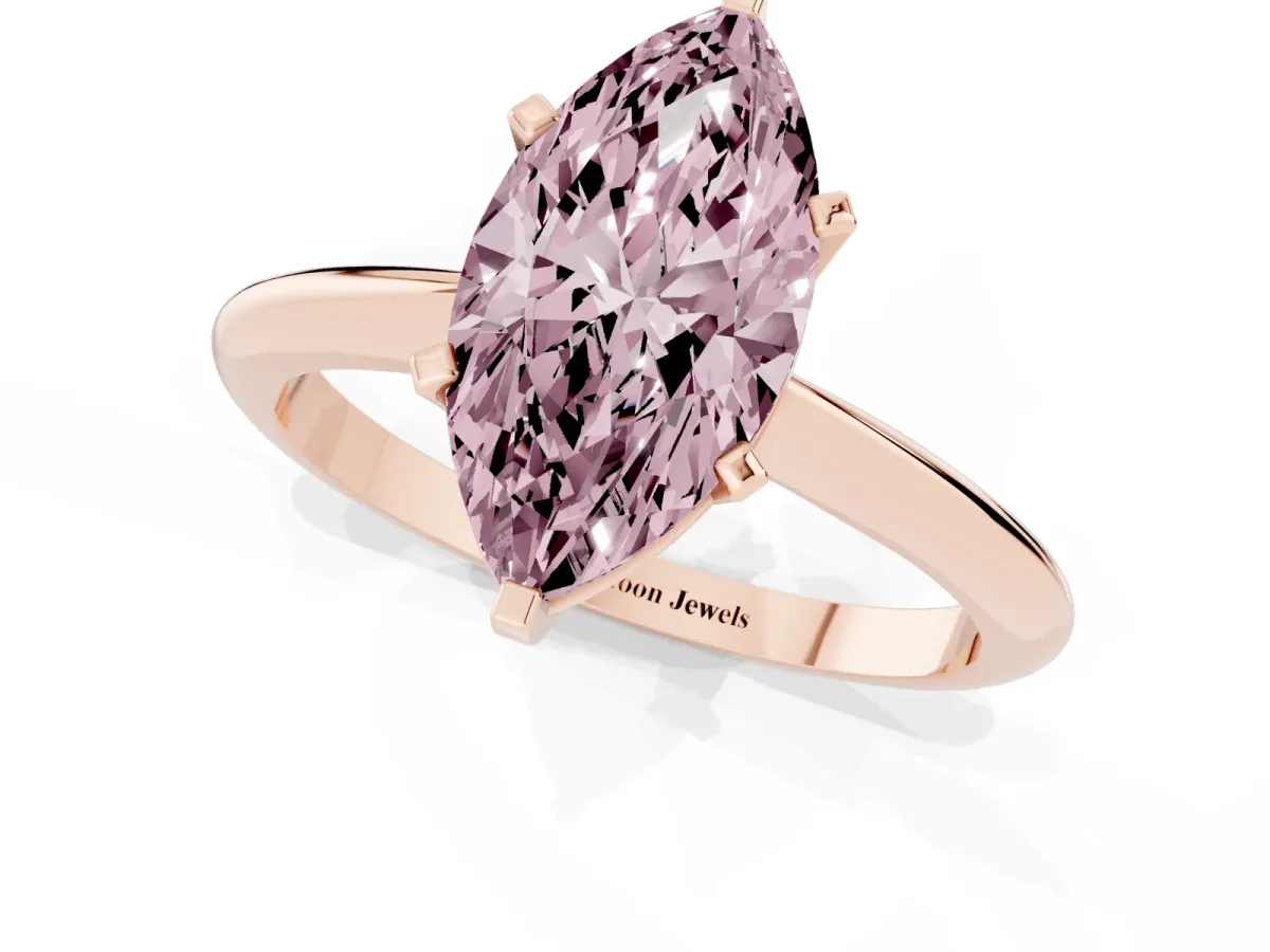 Fancy Pink Marquise Cut Cut Solitaire Ring with Four-Prong Setting on a Classic Band Rose gold