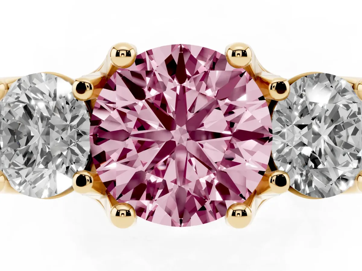 Fancy Pink Round Cut Diamond Three-Stone Ring with Channel Set Band and Four-Prong Setting Yellow gold