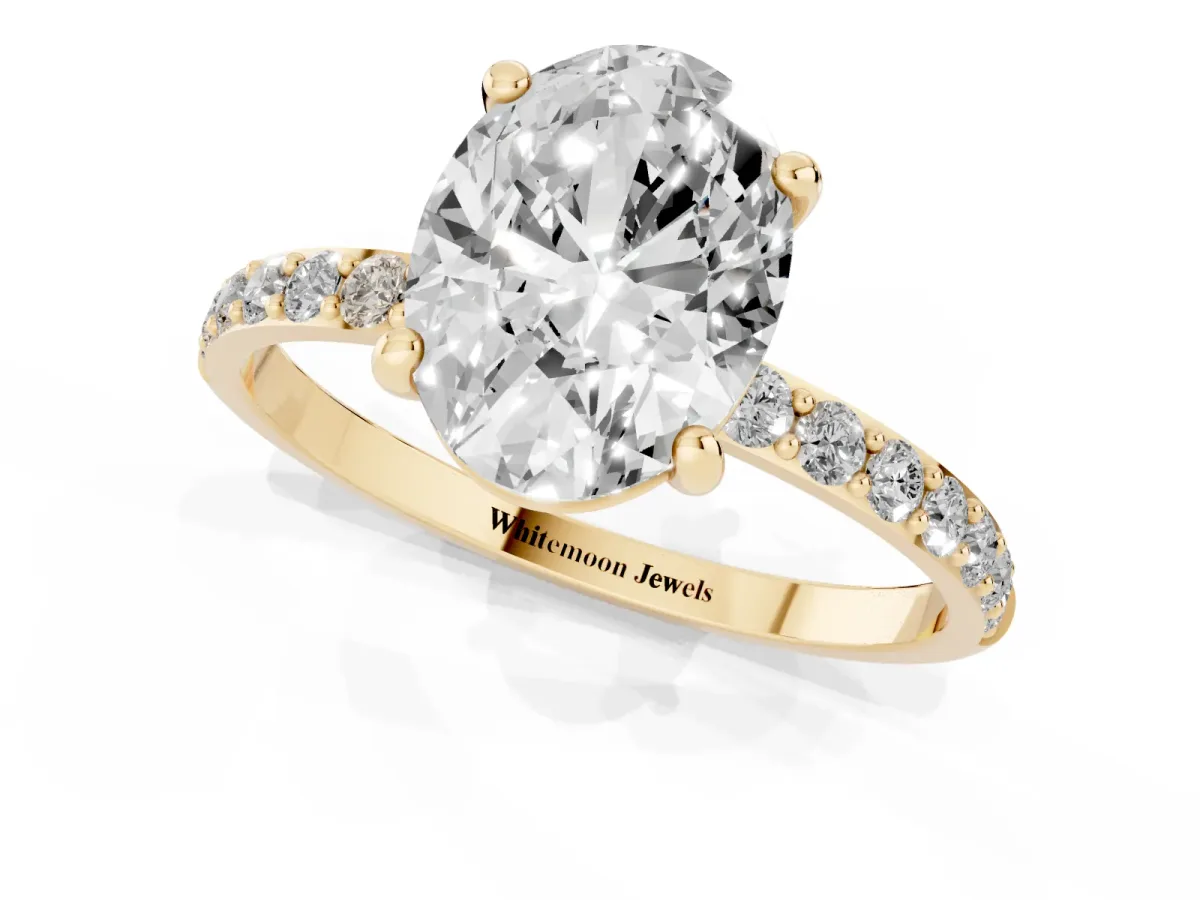 Oval Cut Diamond Solitaire Ring with Round Pavé Band and Prong Setting Yellow gold