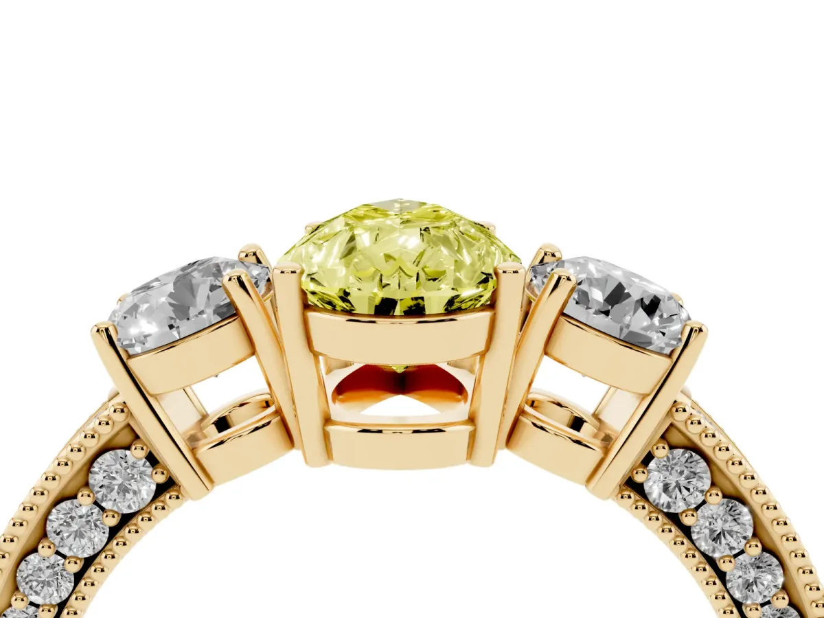Fancy Yellow Pear Cut Three-Stone Diamond Ring with Pavé Band and Four-Prong Setting Yellow gold