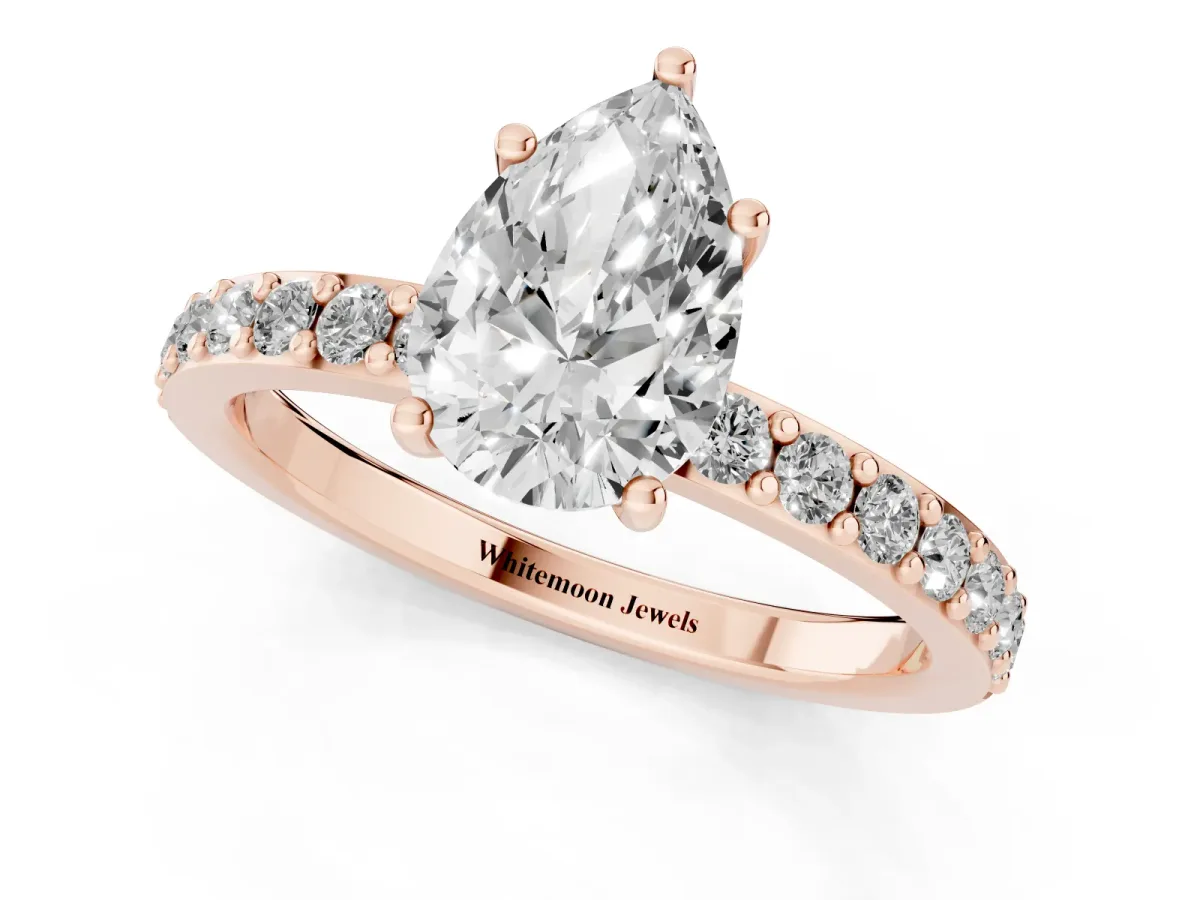 Pear Cut Cut Diamond Solitaire with Pave Band and Four-Prong Setting Rose gold