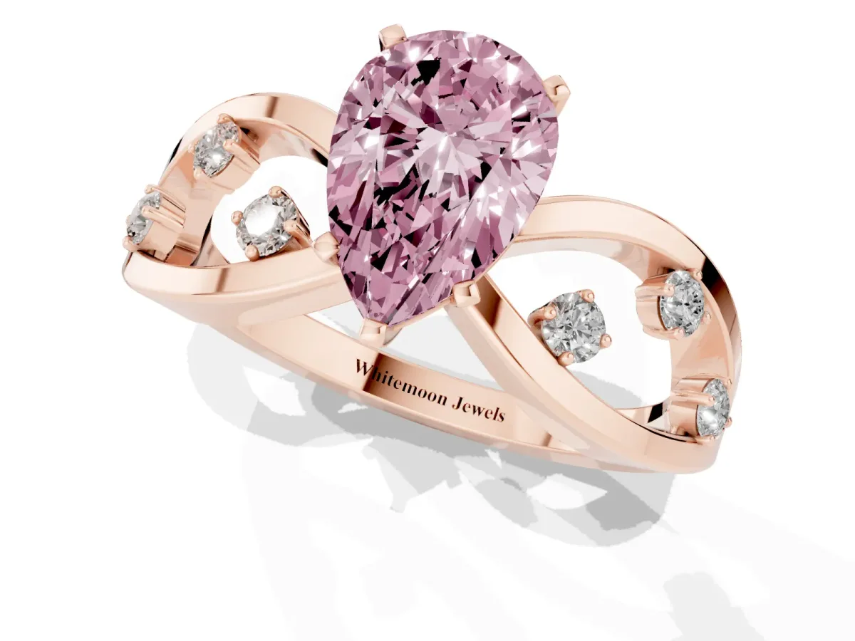 Fancy Pink Pear Cut Cut Solitaire Diamond with Side Stones on Criss-Cross Band and Four-Prong Setting Rose gold