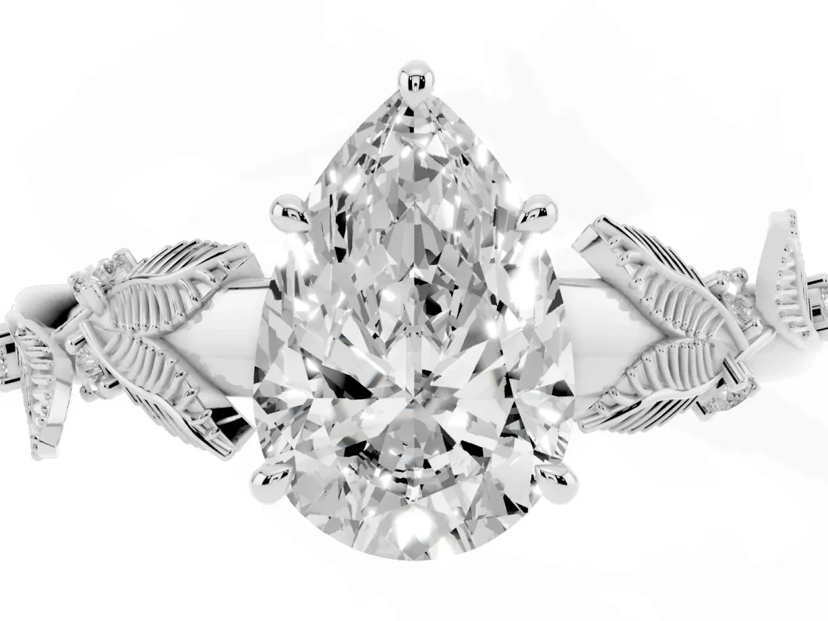 Pear Cut Diamond Solitaire Ring with Leaf Motif Band and Four-Prong Setting Silver