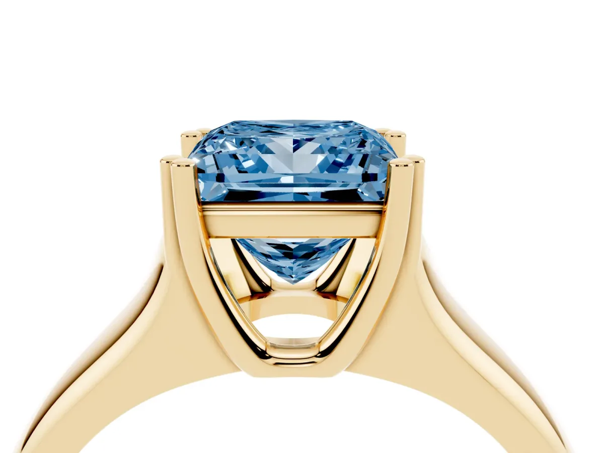 Fancy Blue Princess Cut Diamond Solitaire Ring with Wide Band and Prong Setting Yellow gold