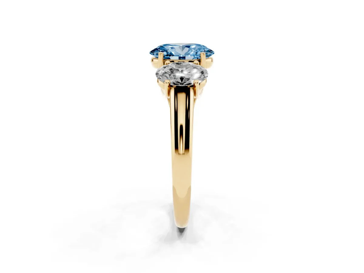 Fancy Blue Three-Stone Oval Cut Diamond Engagement Ring with Prong Setting Yellow gold