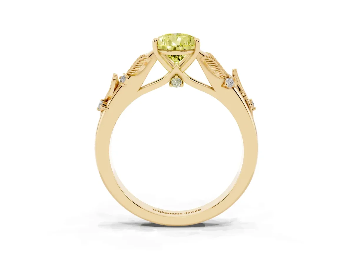 Fancy Yellow Pear Cut Diamond Solitaire Ring with Leaf Motif Band and Four-Prong Setting Yellow gold