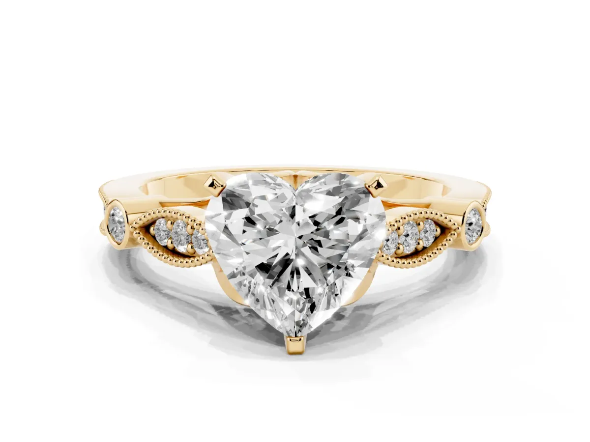 Heart Cut Cut Diamond with Milgrain Marquise and Bezel Accents on a Solitaire Band with Prong Setting Yellow gold