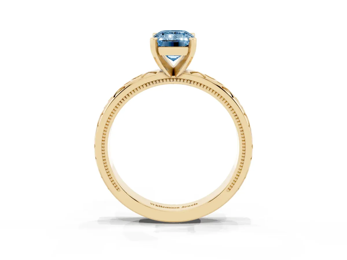 Fancy Blue Emerald Cut Solitaire Engagement Ring with Scrollwork Band and Four-Prong Setting Yellow gold