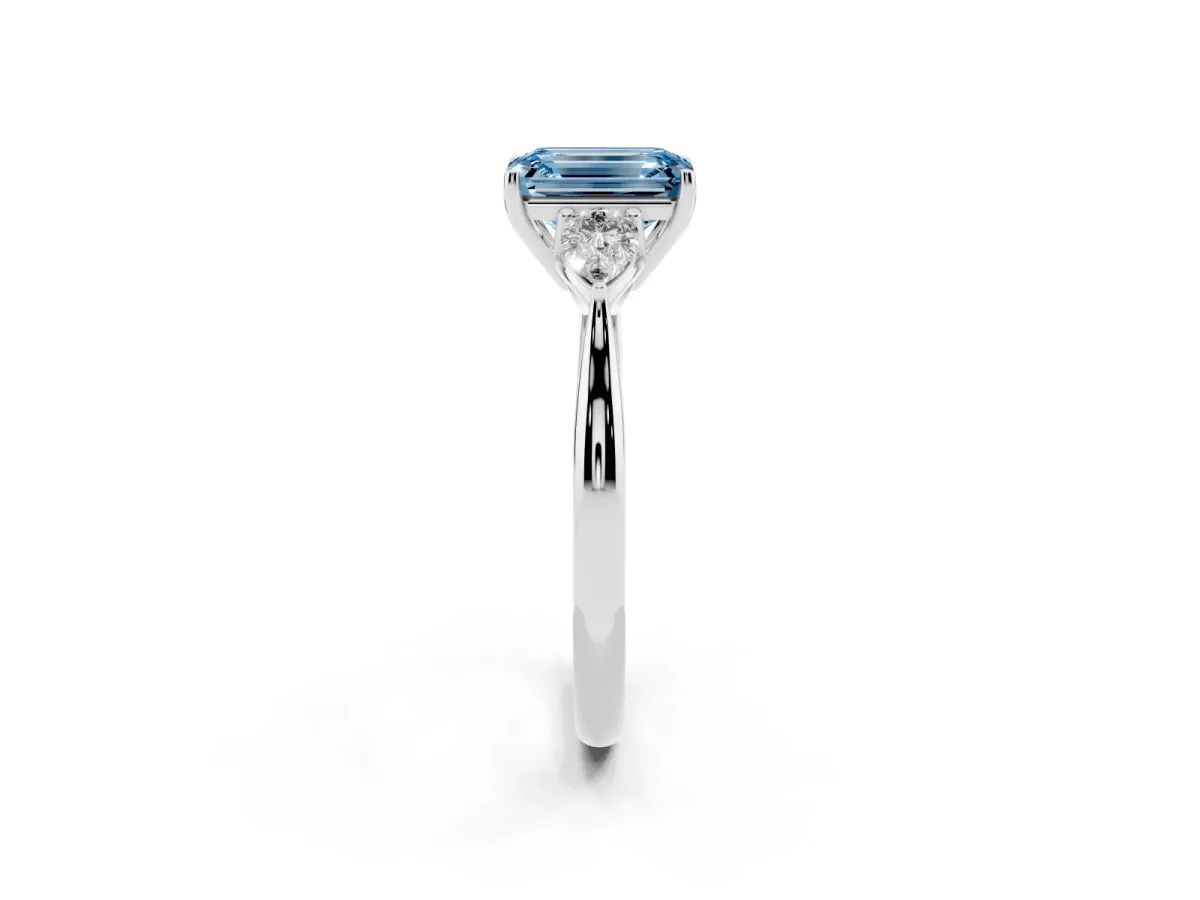 Fancy Blue Emerald Cut Diamond Three-Stone Ring with Pear Side Stones and Prong Setting Platinum