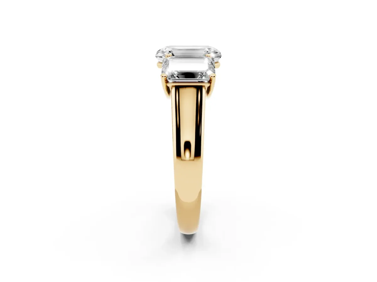 Emerald Cut Three-Stone Diamond Ring with Prong Setting on a Classic Band Yellow gold