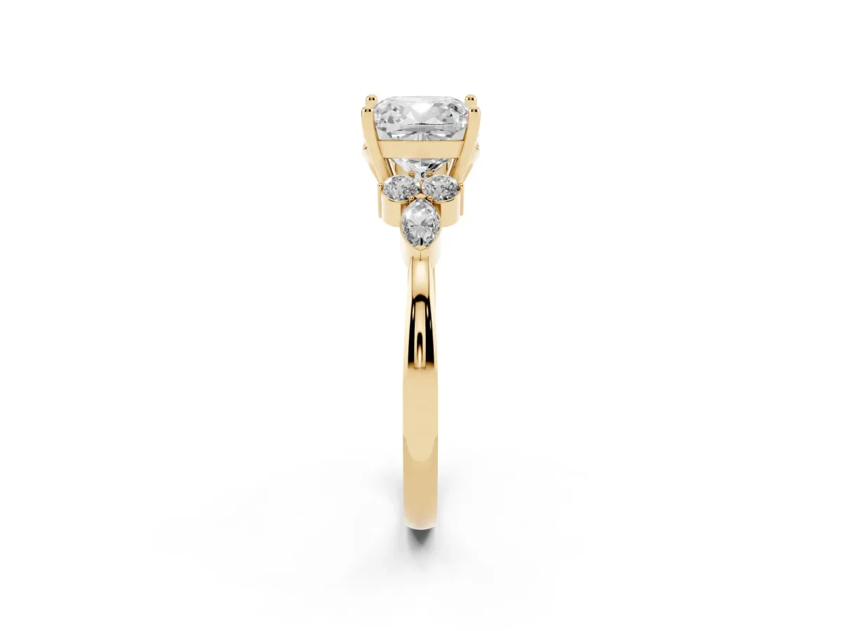 Cushion Cut Brilliant Diamond Solitaire Ring with Pear Side Stones and Four-Prong Setting Yellow gold