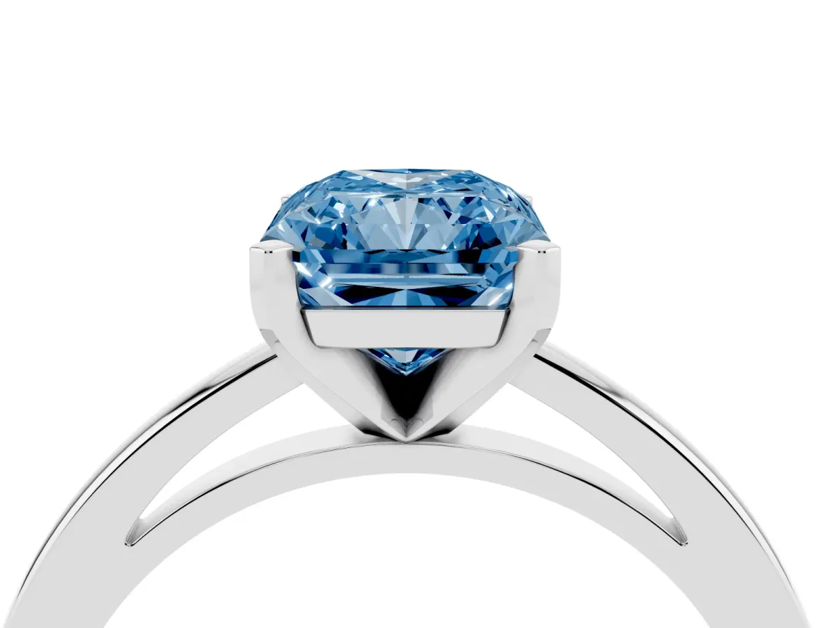 Fancy Blue Radiant Cut Solitaire Diamond Engagement Ring with Four-Prong Setting on a Classic Band Platinum