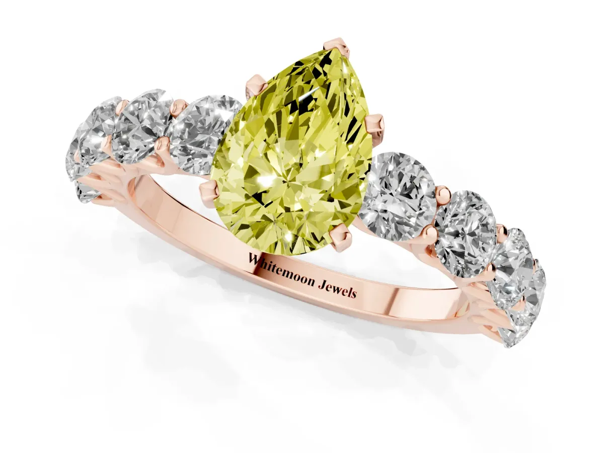 Fancy Yellow Pear Cut Diamond Prong Setting with Side Stones on a Pave Band Rose gold