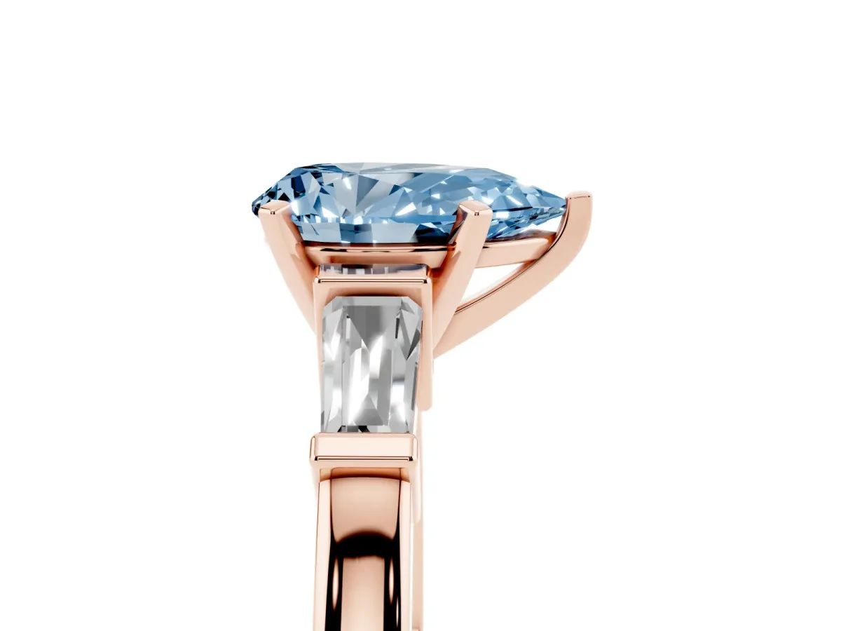 Fancy Blue Pear Cut Cut Diamond Solitaire Ring with Tapered Baguette Accents and Four-Prong Setting Rose gold