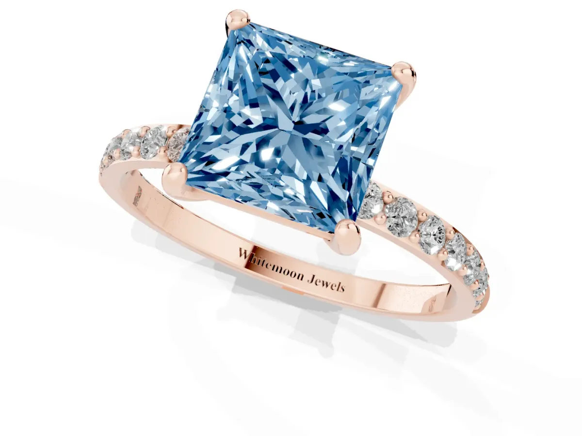 Fancy Blue Princess Cut Diamond Solitaire Ring with Round Pavé Band and Prong Setting Rose gold