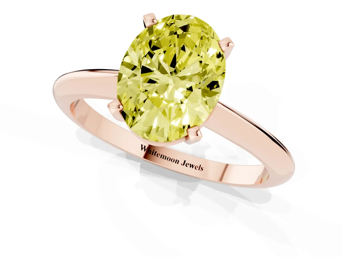 Fancy Yellow Oval Cut Cut Solitaire Ring with Four-Prong Setting on a Classic Band Rose gold