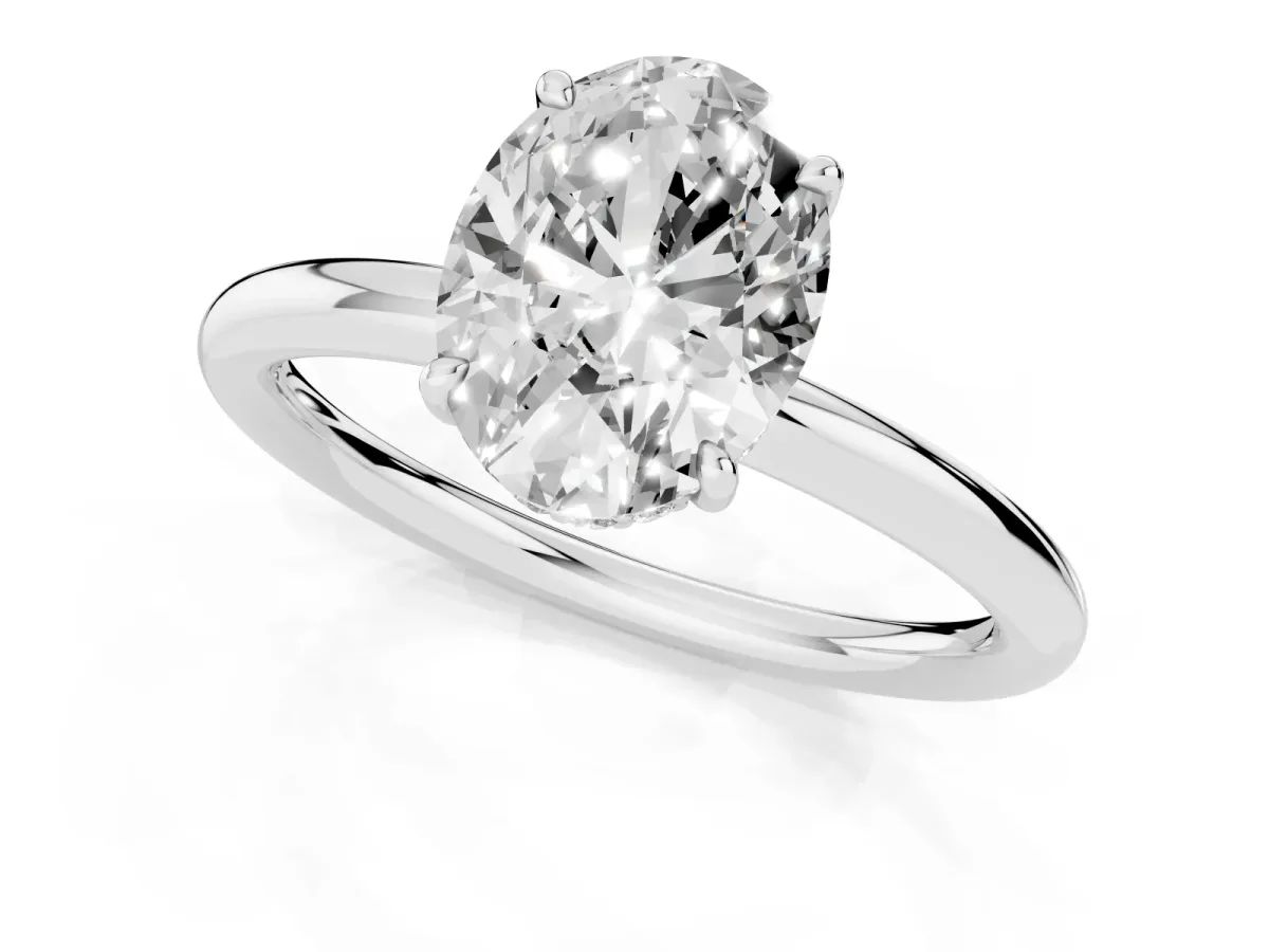 Oval Cut Diamond Solitaire Ring with Thin Band and Four-Prong Setting Silver