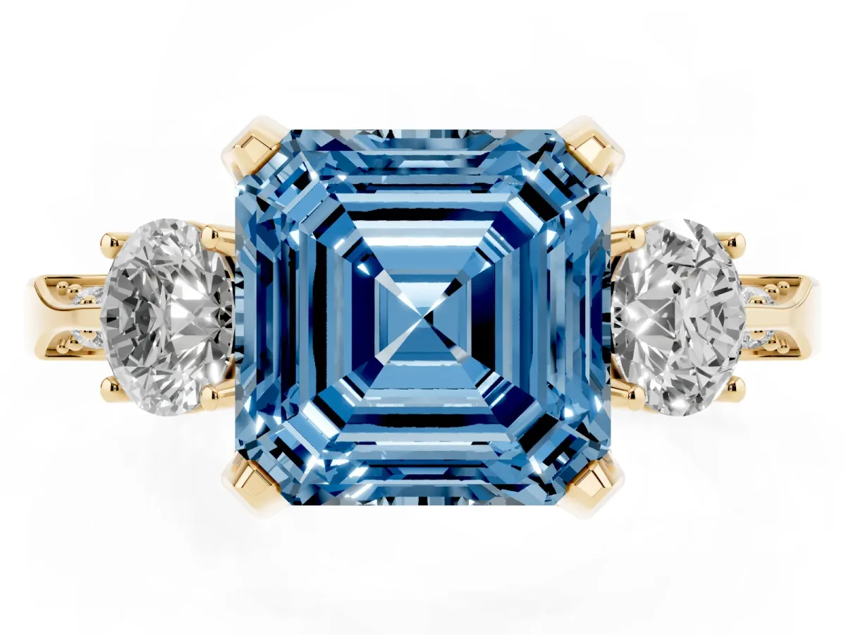 Fancy Blue Asscher Cut Brilliant Three-Stone Diamond Ring with Pavé Band and Four-Prong Setting Yellow gold