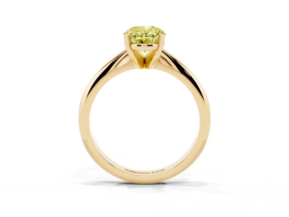 Fancy Yellow Oval Cut Cut Solitaire Ring with Four-Prong Setting on a Classic Band Yellow gold