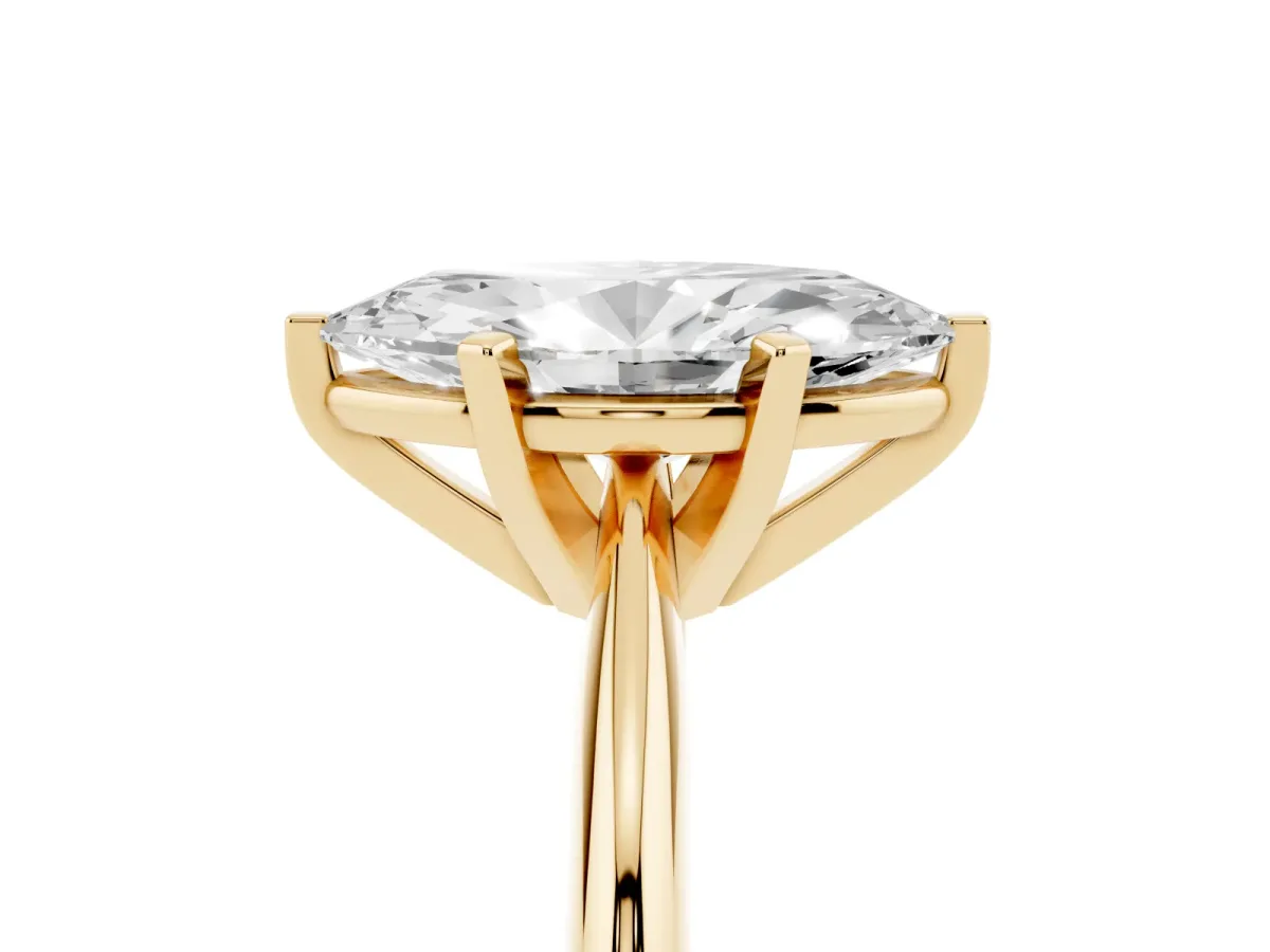 Marquise Cut Cut Solitaire Ring with Four-Prong Setting on a Classic Band Yellow gold