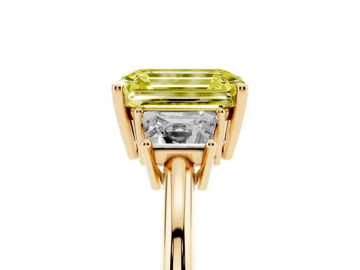 Fancy Yellow Emerald Cut Diamond Three-Stone Ring with Trapezoid Side Stones and Prong Setting Yellow gold