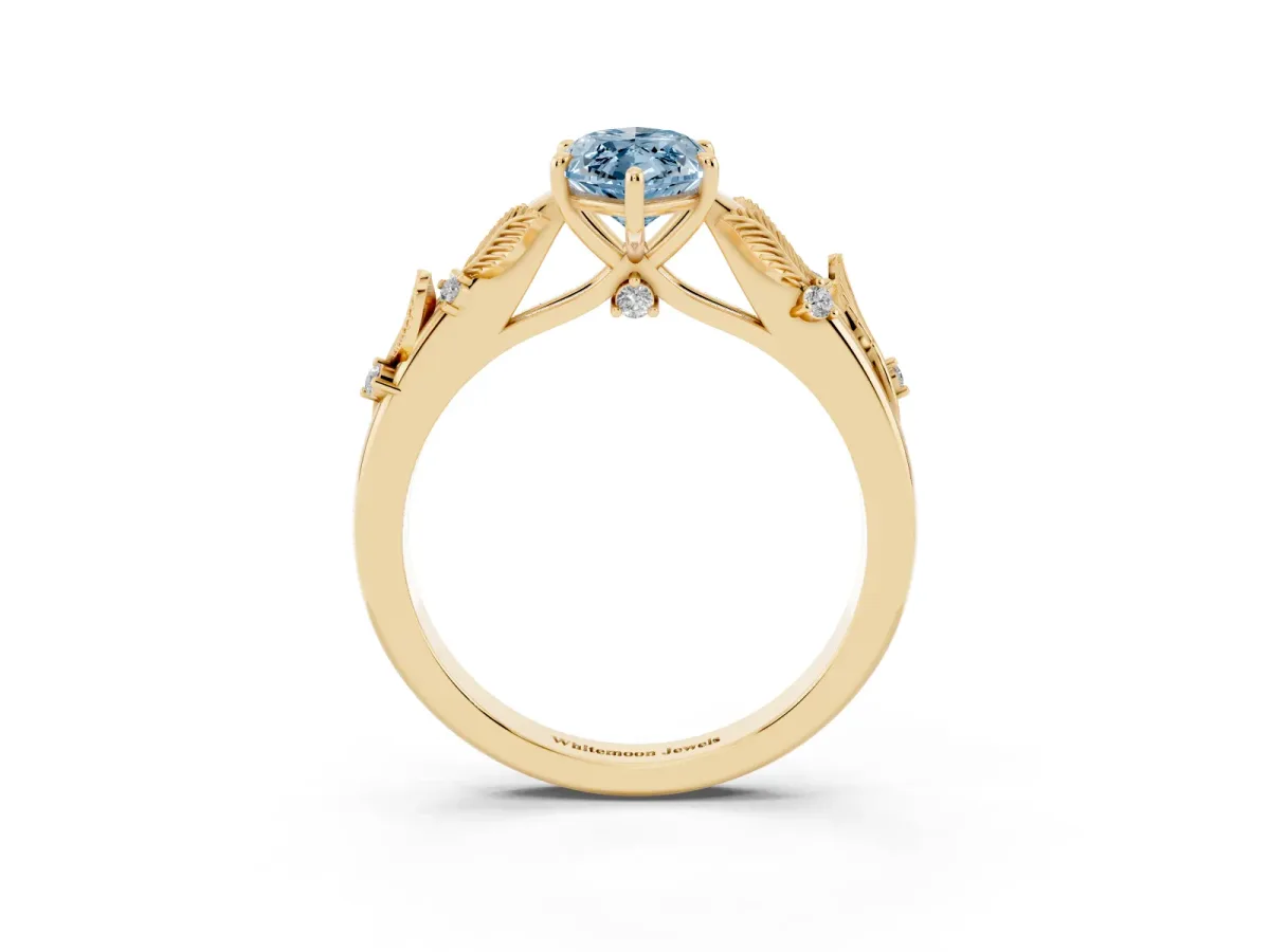 Fancy Blue Marquise Cut Diamond Solitaire Ring with Leaf Motif Band and Four-Prong Setting Yellow gold