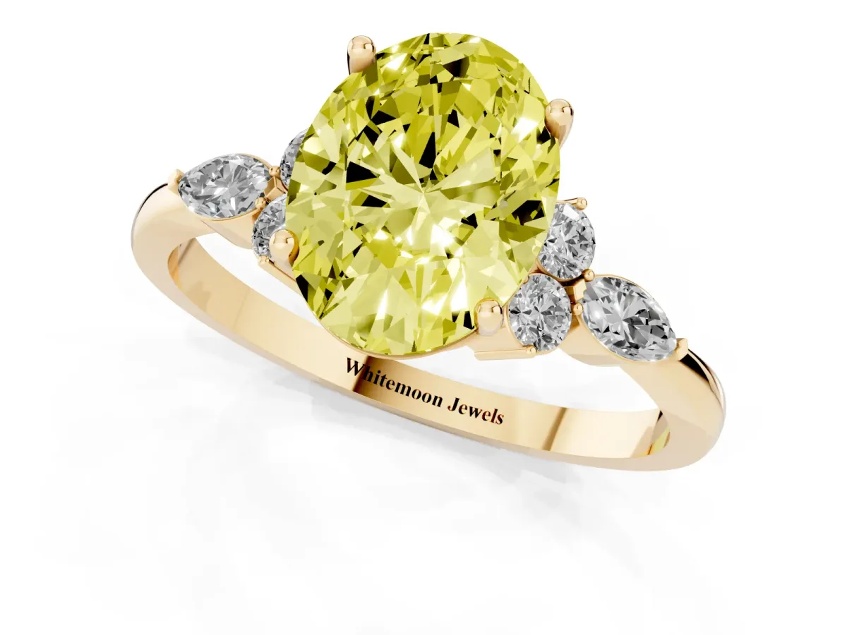 Fancy Yellow Oval Cut Brilliant Diamond Solitaire Ring with Pear Side Stones and Four-Prong Setting Yellow gold