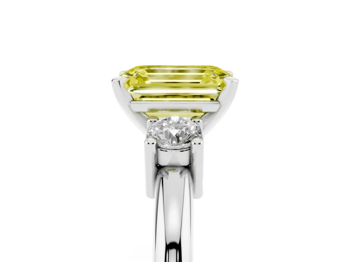 Fancy Yellow Three-Stone Emerald Cut Cut Diamond Solitaire with Prong Setting and Classic Band Silver