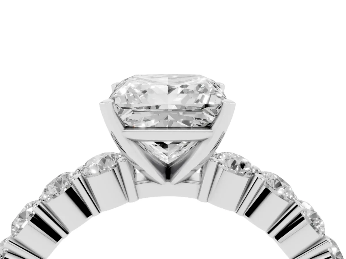 Princess Cut Diamond Solitaire Ring with Shared Prong Round Side Stones Silver