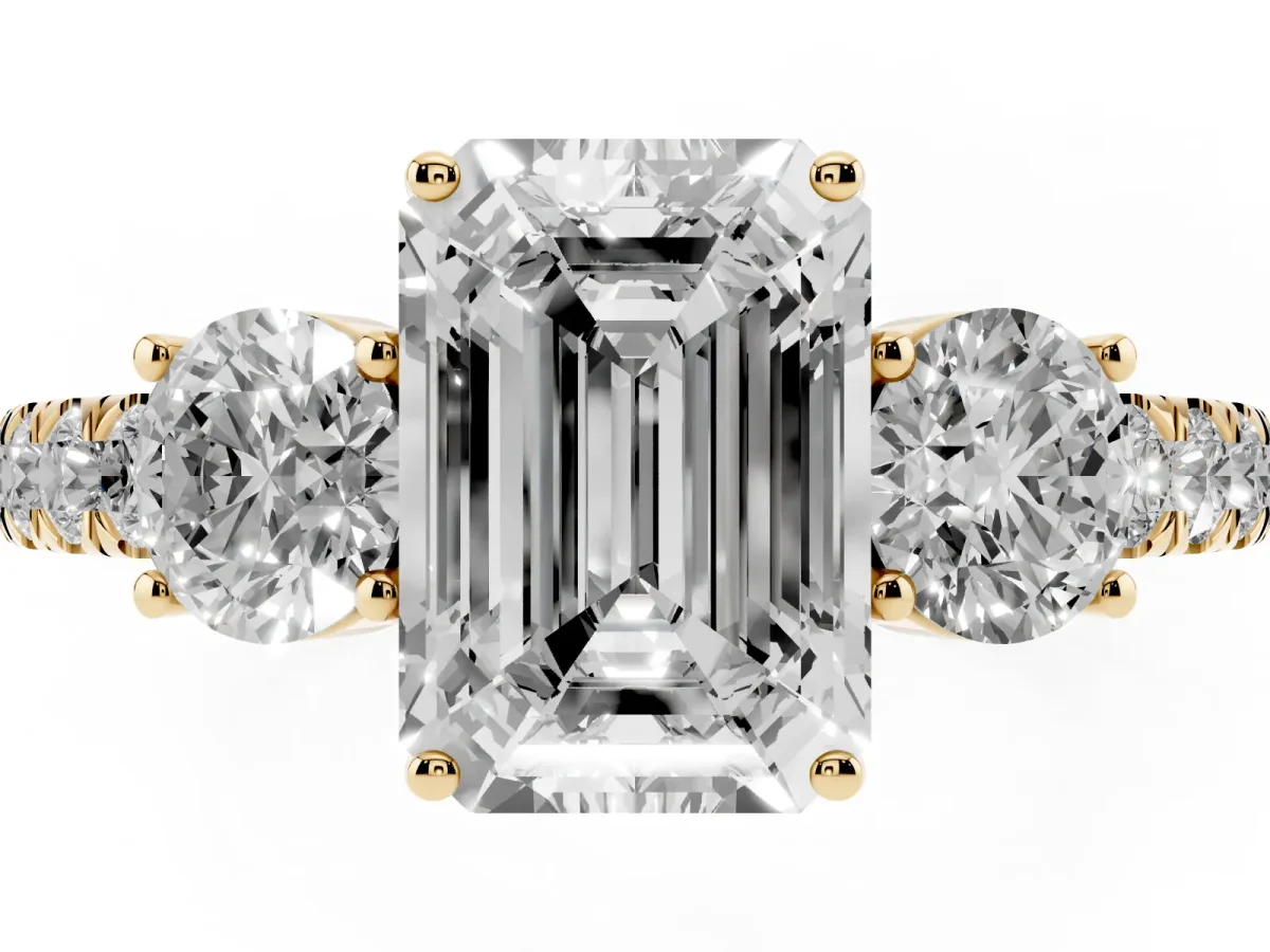 Emerald Cut Cut Diamond Three-Stone Ring with Round Side Stones and Pavé Band Yellow gold