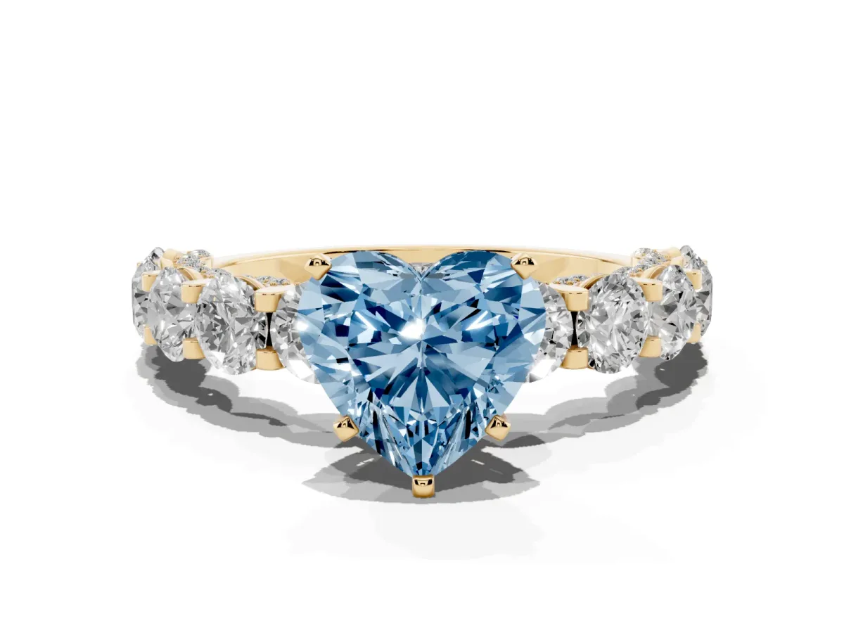 Fancy Blue Heart Cut Diamond Side Stone Engagement Ring with Four-Prong Setting Yellow gold