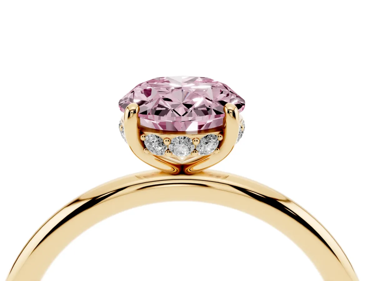 Fancy Pink Oval Cut Solitaire Diamond Ring with a Classic Band and Four-Prong Setting Yellow gold