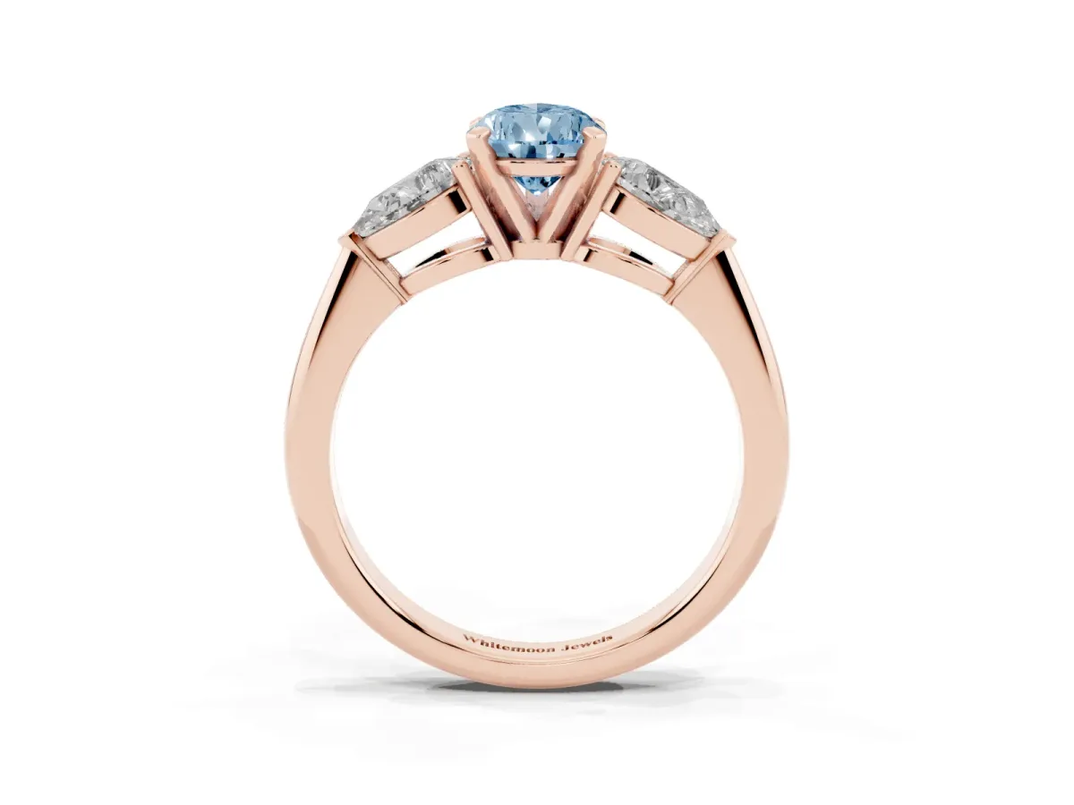Fancy Blue Three-Stone Pear Cut Diamond Ring with Pear Side Stones and Four-Prong Setting Rose gold
