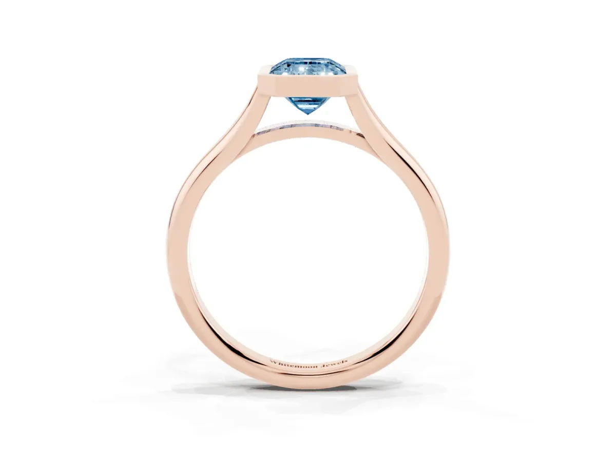 Fancy Blue Bezel Set Emerald Cut Cut Solitaire Ring with Tapered Band Rose gold