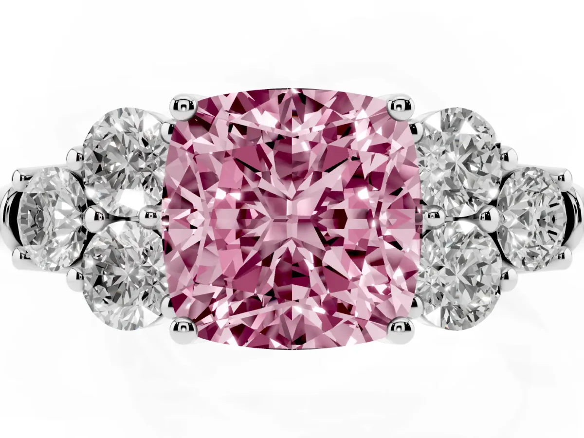 Fancy Pink Cushion Cut Cut Diamond Cluster Ring with Round Accent Stones and Prong Setting on a Classic Band Platinum