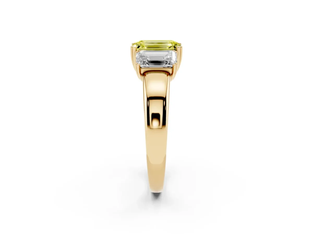 Fancy Yellow Three-Stone Emerald Cut Cut Diamond Ring with Channel Set Band and Four-Prong Setting Yellow gold