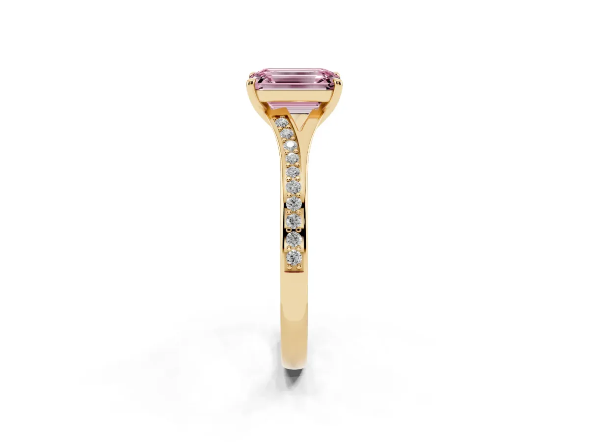Fancy Pink Emerald Cut Diamond Solitaire Ring with Pavé Band and Prong Setting Yellow gold