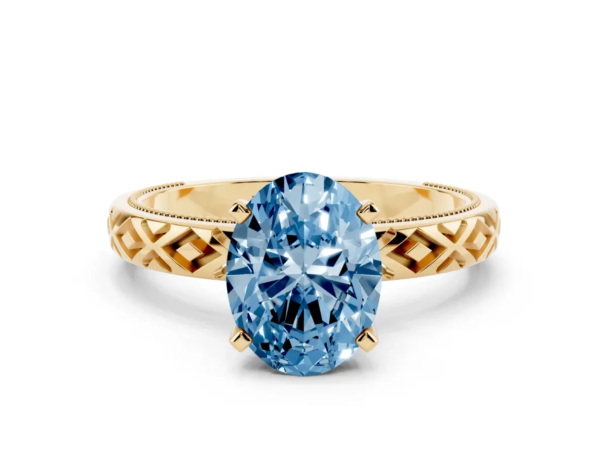 Fancy Blue Oval Cut Solitaire Diamond Ring with Milgrain and Black Enamel X Pattern Band Yellow gold