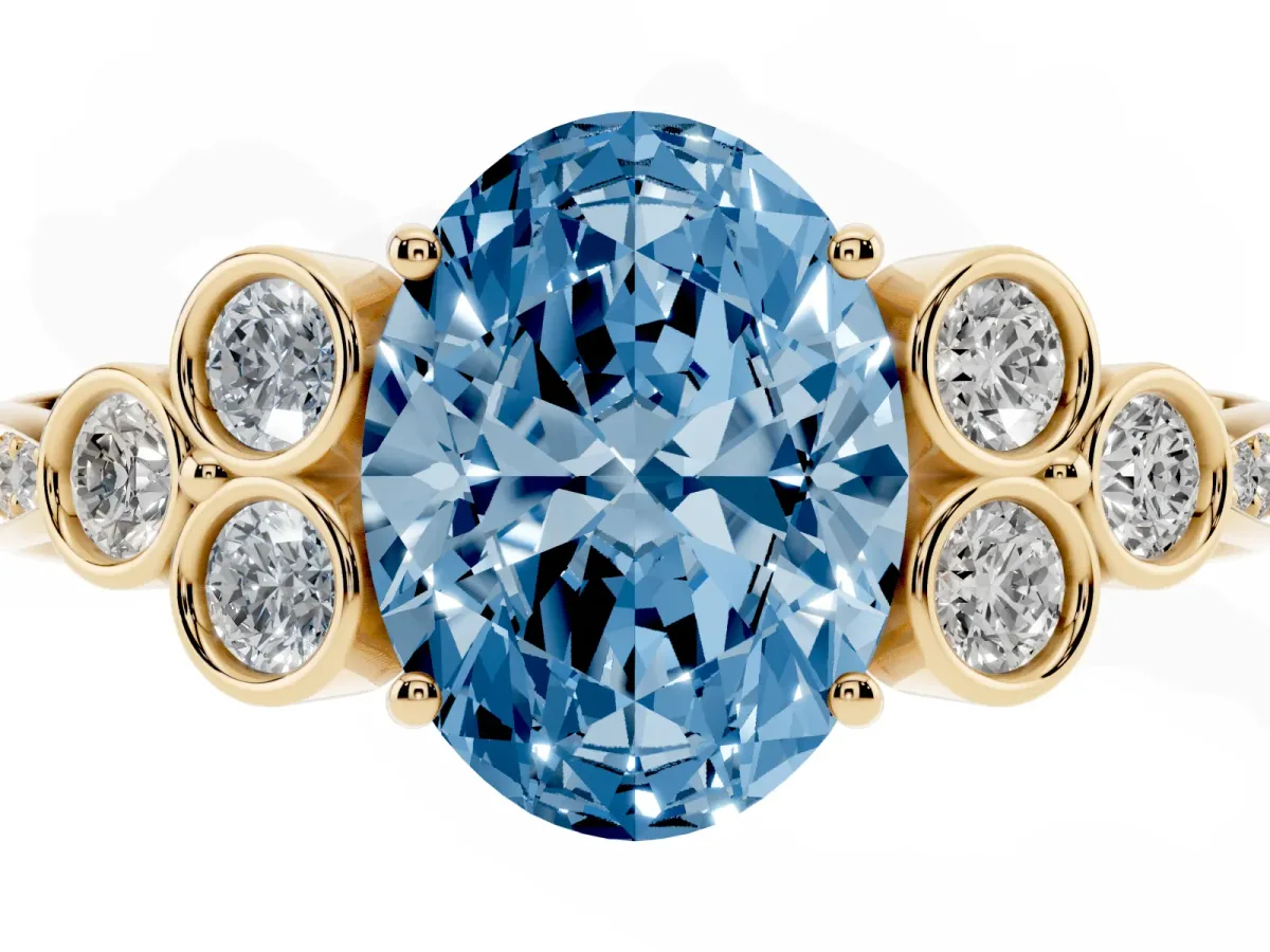 Fancy Blue Oval Cut Cut Diamond Engagement Ring with Bezel Set Round Side Stones and Prong Setting Yellow gold