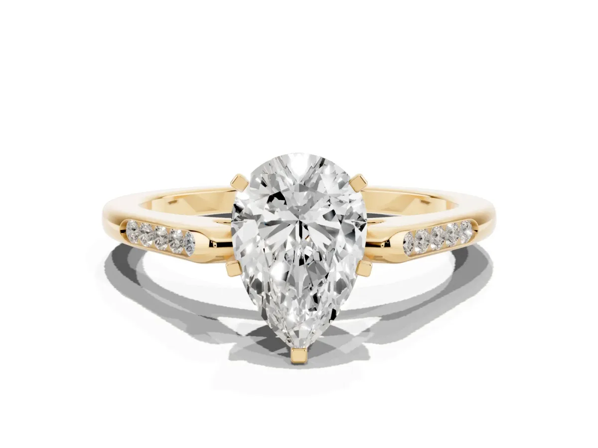 Pear Cut Diamond Solitaire Ring with Channel Set Round Band and Prong Setting Yellow gold