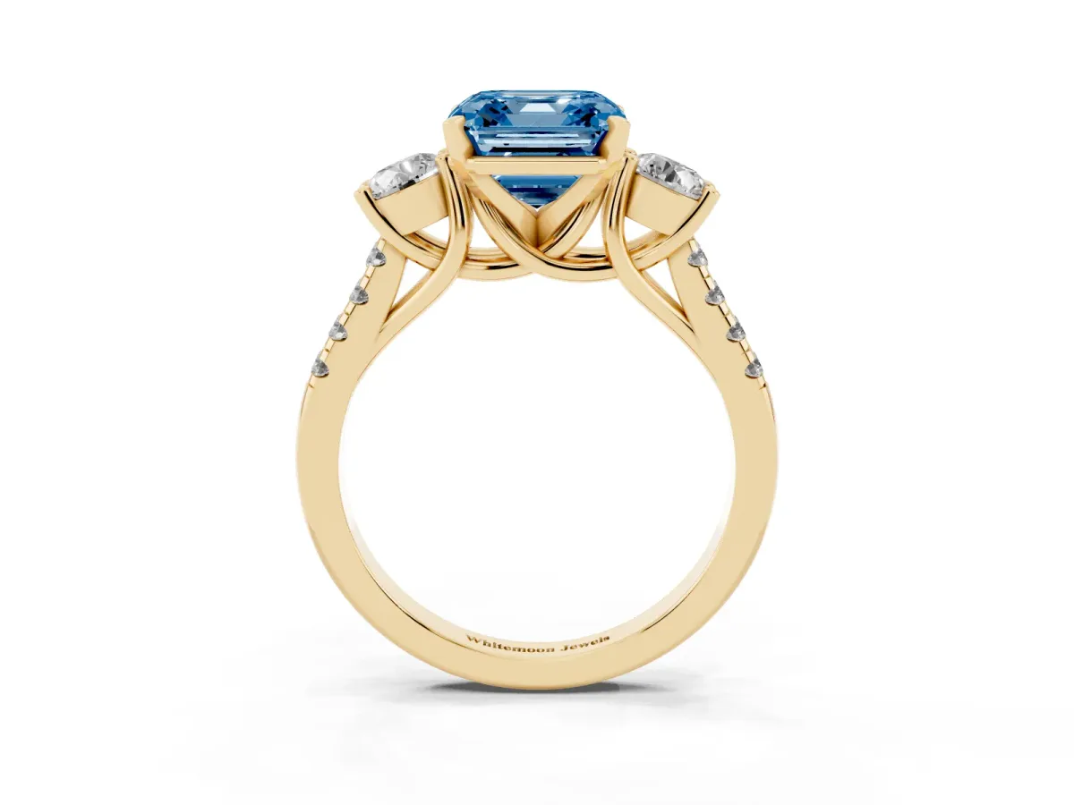 Fancy Blue Three-Stone Asscher Cut Diamond Pavé Band with Four-Prong Setting Yellow gold