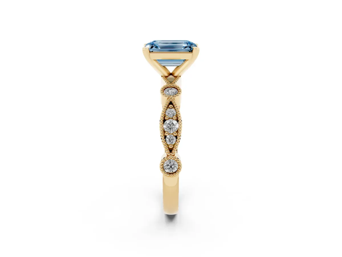 Fancy Blue Emerald Cut Milgrain Bezel Diamond Engagement Ring with Solitaire Prong Setting Yellow gold
