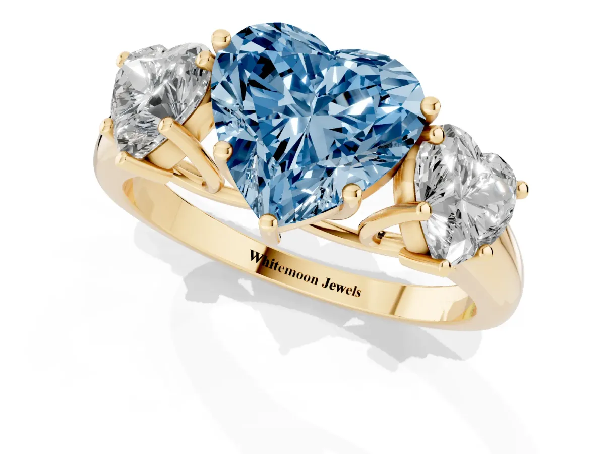 Fancy Blue Three-Stone Heart Cut Diamond Engagement Ring with Prong Setting Yellow gold