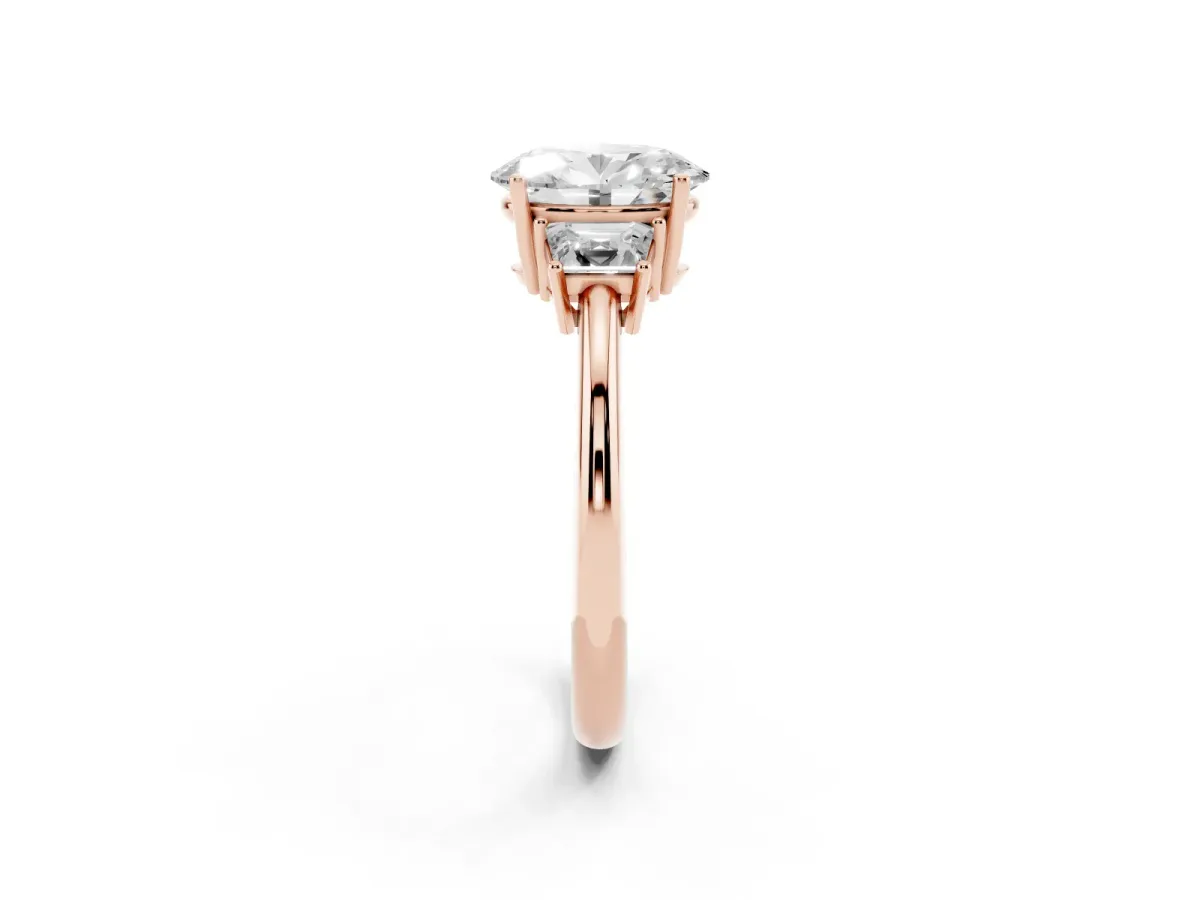 Oval Cut Diamond Three-Stone Ring with Trapezoid Side Stones and Prong Setting Rose gold